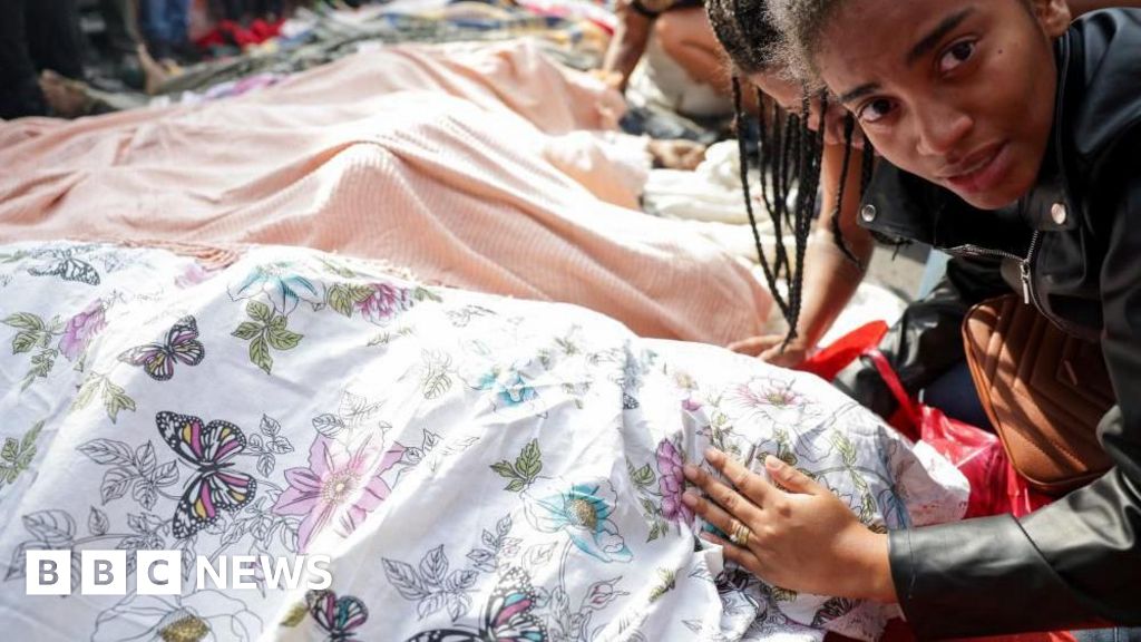 At least 132 killed in Rio police raid, officials say