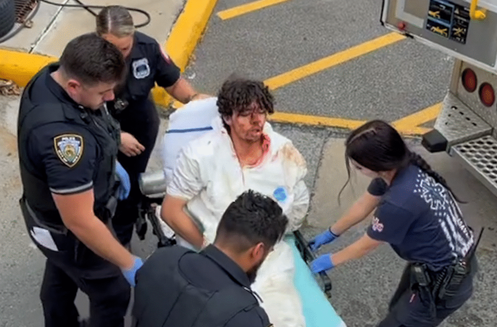 Bloodied Staten Island decapitation suspect removed from precinct on a gurney