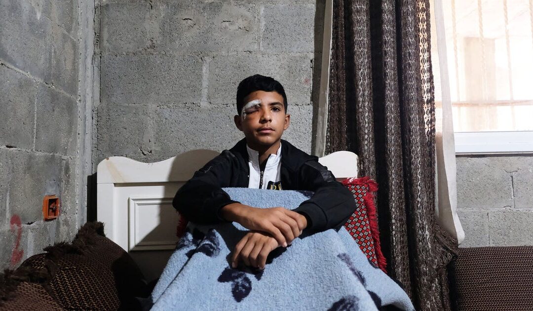 A Palestinian boy waited for his school bus. An Israeli soldier fired a tear-gas canister in his face