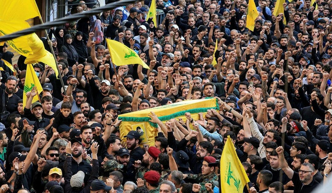 'We'll never surrender our weapons': Thousands mourn Hezbollah military chief killed by Israel