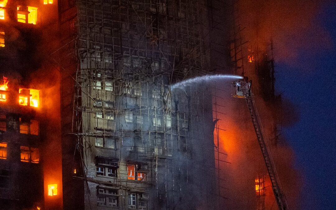 13 people killed in fire engulfing Hong Kong high-rise residential buildings, fire services say