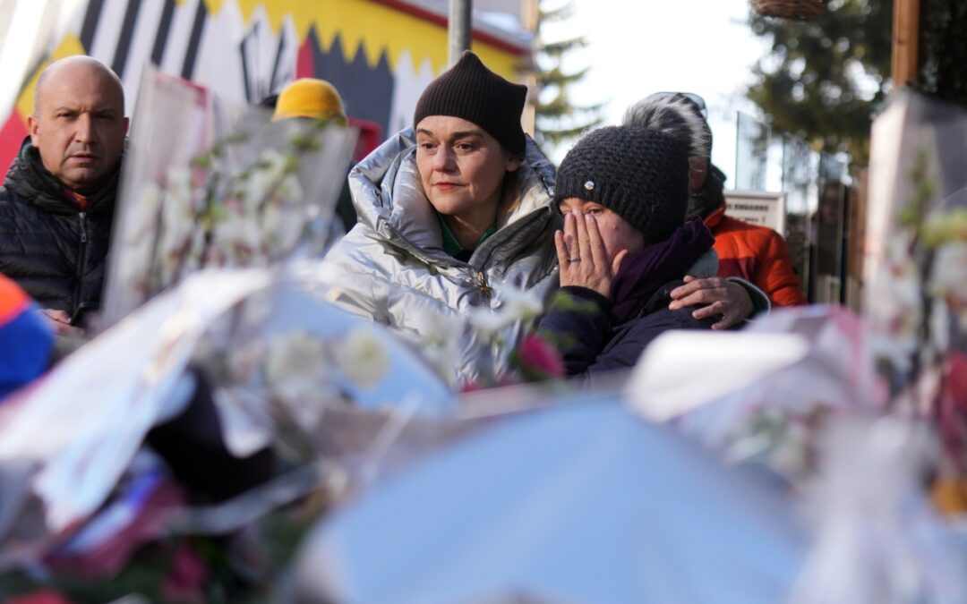 Swiss investigators believe sparkling candles atop wine bottles ignited fatal bar fire